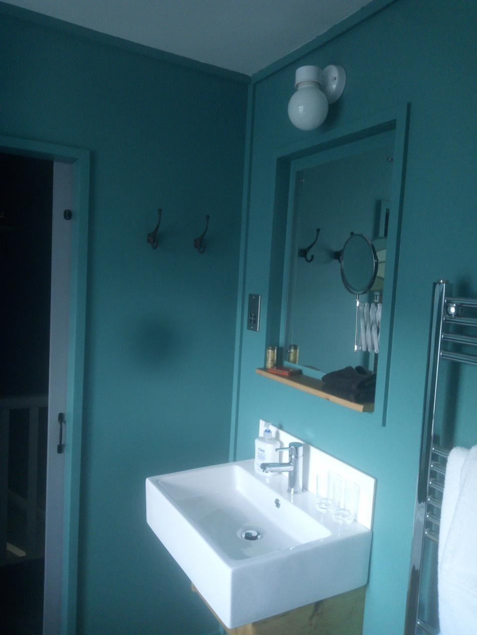 Holiday let bathroom refurbishment, fitted sink and mirror