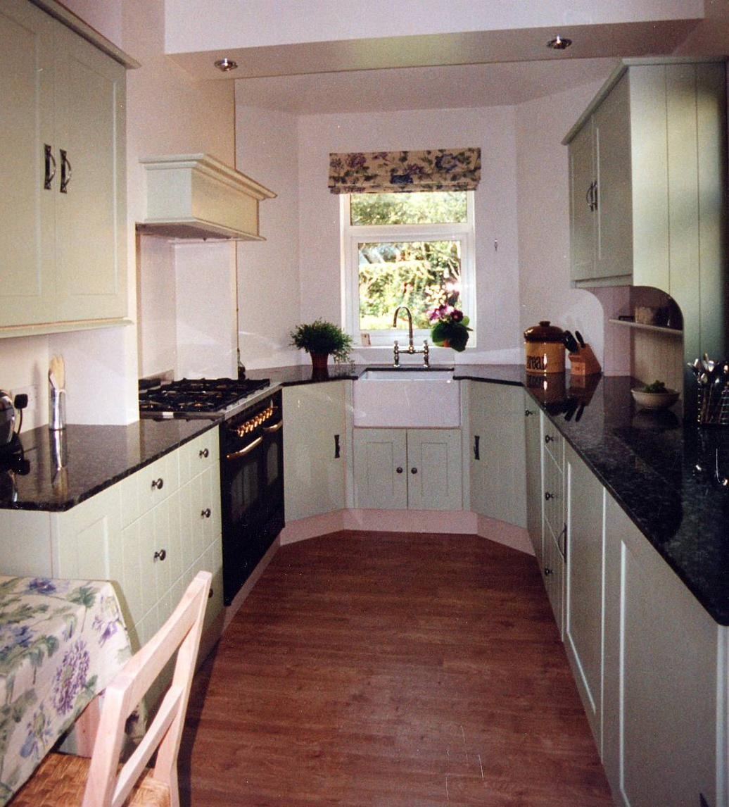 Sage green shaker kitchen with butler sink