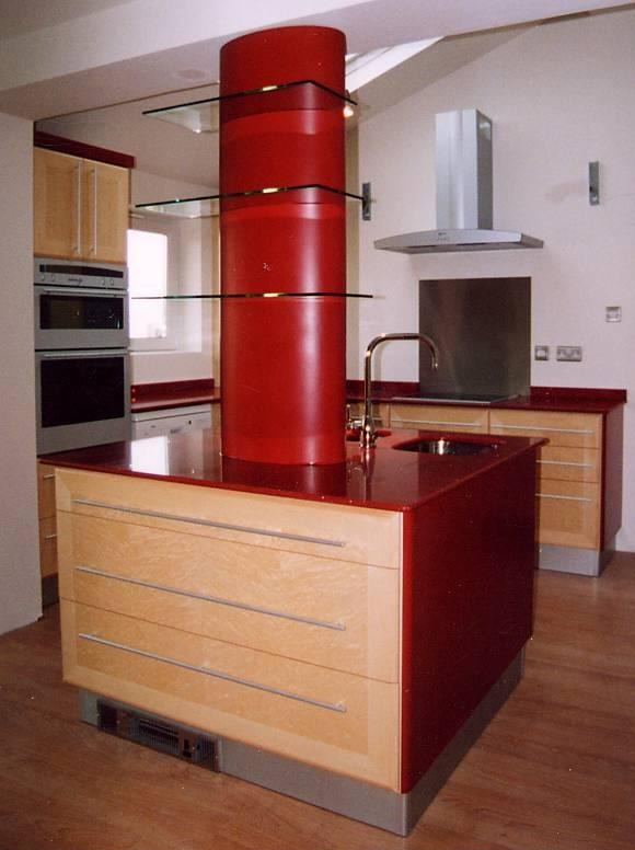 Bird's eye maple veneer kitchen with red granite worktops
